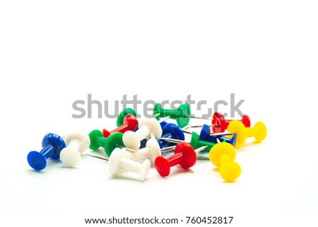 Multi-color push pin on a white background.