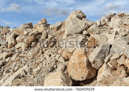 Big stone pile outdoors. For the construction of structures that require high stability.
