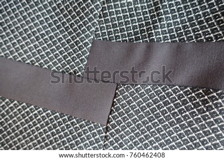 Two strips of brown fabric sewn to grey one
