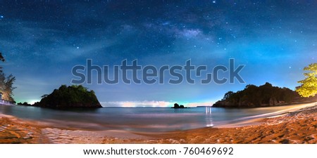 Panorama view of the milky way in night sky over beach, Thailand