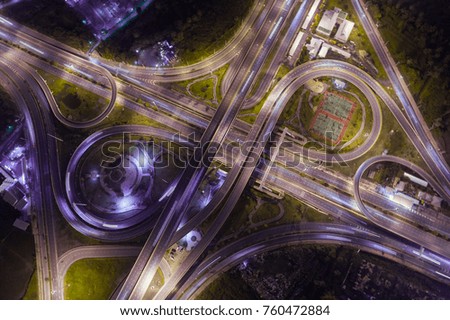 Top view over the highway, expressway and motorway at night, Aerial view interchange of a city, Shot from drone, Expressway is an important infrastructure in Thailand