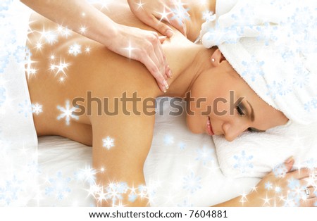 christmas picture of lovely lady relaxing in massage salon