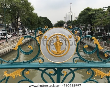 The Bangkok city seal on a pedestrian bridge crossing Khlong Phadung Krung Kasem, a canal in Bangkok. The seal depicts Hindu god Indra riding on Airavata, showing beliefs in Hinduism in Thai culture.