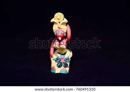 Clay Handmade Statue of a Cuban Woman on Black Background