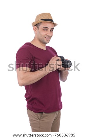Stylish male Photographer holding his DSLR. Isolated on white background.