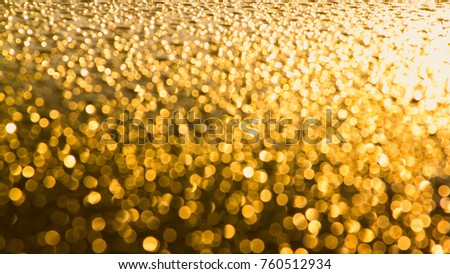 abstract bokeh blurred gold color Background.