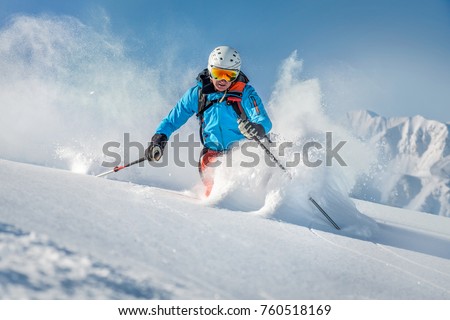 Male freeride skier in the mountains Royalty-Free Stock Photo #760518169