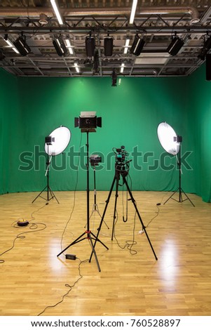 Studio for filming on a green background. The chroma key. Lighting equipment in the Studio. Green screen.