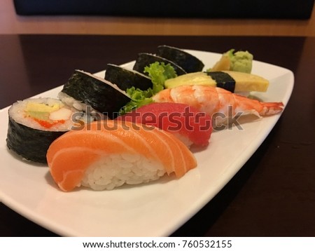 sushi roll with tuna, salmon, shrimp, butterfish on rice Japanese food Royalty-Free Stock Photo #760532155