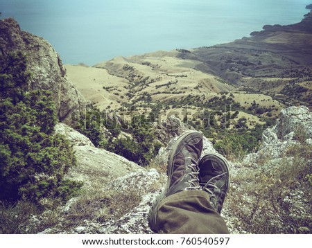 Landscape of the Crimean coast with mountains, sea, coast and trees near Karadag