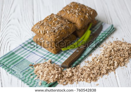 bread with sunflower seeds on a wooden table