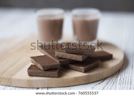 chocolate and chocolate pieces on a wooden Board on the table