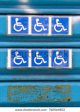Garage door with accessibility signage