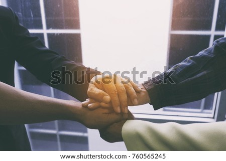 Business people join hand together during their meeting teamwork concepts