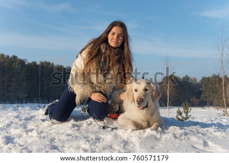 Girl with dog. Golden retriever.Girl with Golden Retriever, on nature background. Girl playing with a dog on the nature. Золотистый Ретривер.  