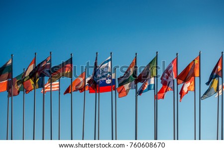 Flags of the world on the background of blue sky