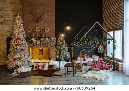 Vintage style interior of fireplace with christmas tree, vintage chair, artificial snow, beautiful bed