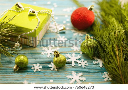 New year card with toys, snowflakes, surprise box, branches of a Christmas tree
