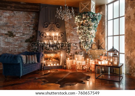 alternative tree upside down on the ceiling. Winter home decor. Modern loft interior with fireplace and brick wall Royalty-Free Stock Photo #760657549