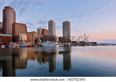 Boston harbor at Sunrise viewing from Fan Pier Park, Boston, Massachusetts, USA. Boston Harbor is a natural harbor and estuary of Massachusetts Bay, located adjacent to city of Boston,MA.