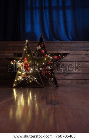 Christmas decorations of dark wood. Two stars.