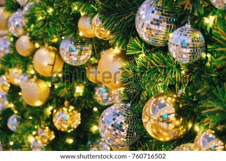 Shiny christmas ball and light on christmas tree, holiday concept