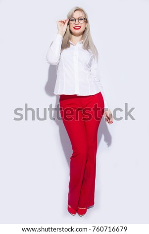 Friendly business woman smiling isolated over a white background