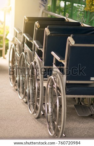 Close-up Empty wheelchair in front of the Outpatient Department of Hospital with sunlight