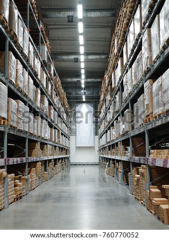 Indoor modern storage warehouse space with row of boxes and shelves