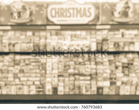 Blurred verity Christmas cards on display at retail store in America. Seasonal, greeting, holiday card for event such as Merry Christmas, Happy New Year, Happy Birthday, Anniversary Day. Vintage tone