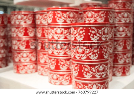 blur picture background  of  red Christmas gift  box on shelf  in  furniture mall 
