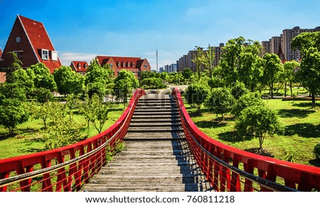 bridge in the park with city