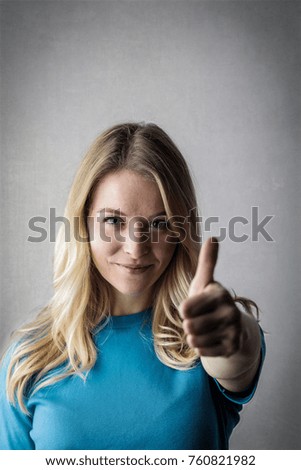 Blonde woman showing a positive attitude