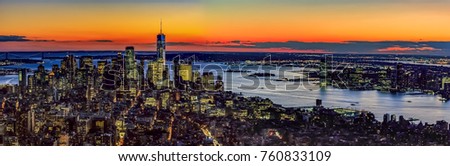 Panoramic aerial view across lower Manhattan and New Jersey, after sunset.