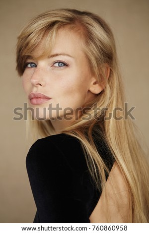 Glamorous blond in black fashion, portrait Royalty-Free Stock Photo #760860958