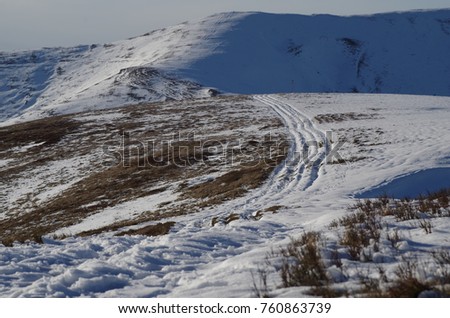 Mountain winter landscape footprints in the snow, Carpatian