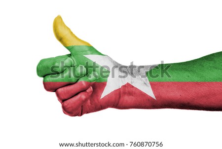 Old woman with arthritis giving the thumbs up sign, isolated on white - Myanmar
