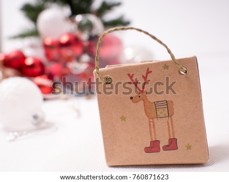 Decorations of Christmas : package with reindeer.