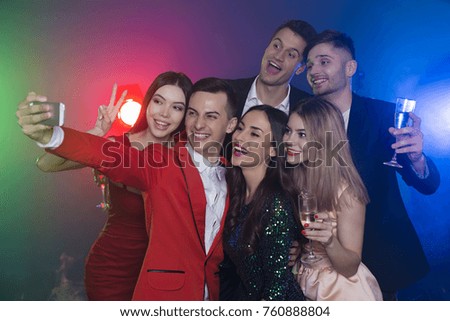 Company of happy friends at the party make a selfie photo with champagne. New Year. Birthday. Christmas.