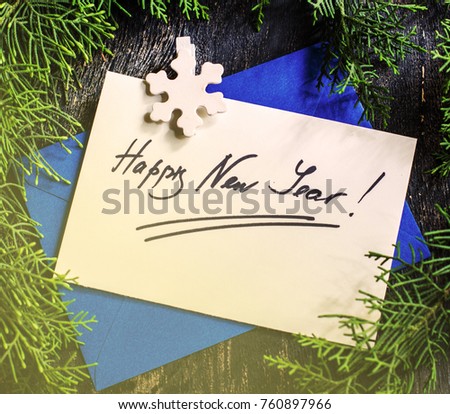 Gift boxes and cards for Christmas celebration with festive decorations on rustic wooden backgroubd with copyspace