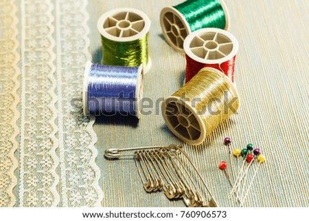 sewing accessories: threads, pins, laces. close-up