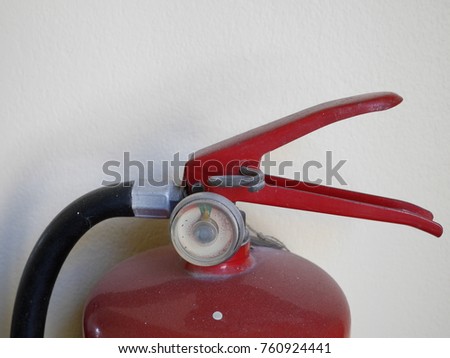 Fire extinguisher at the wall