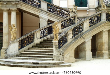 Beautiful baroque Stairs, iron railings with gold details. Detail of Esterhazy Palace in Fertod, Hungary.  Royalty-Free Stock Photo #760930990
