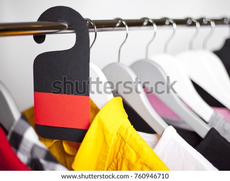 Black Friday shopping sale concept. Sale in a clothing store - discount sign at a clothes rack