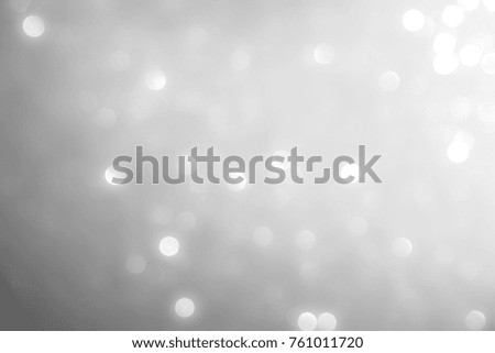 silver and white Sparkling Lights Festive background with texture. Abstract Christmas twinkled bright bokeh defocused and Falling stars. Winter Card or invitation.