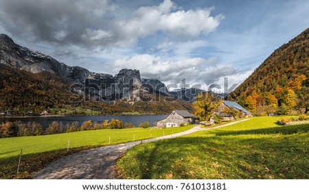 Beautiful Autumn View on Grundlsee lake. Wonderful Landscape with a perfect clouds in the sky, over the incredible Alpine Lake. Styria, Austria, Europe. Splendid, breathtaking view of Alps Mountains.