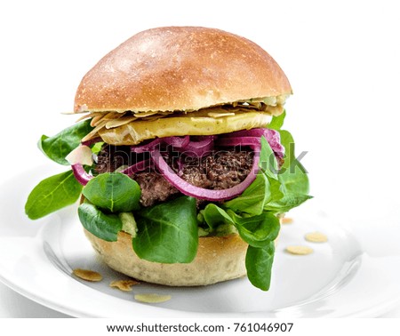 gourmet burger with juicy beef and lamb's lettuce