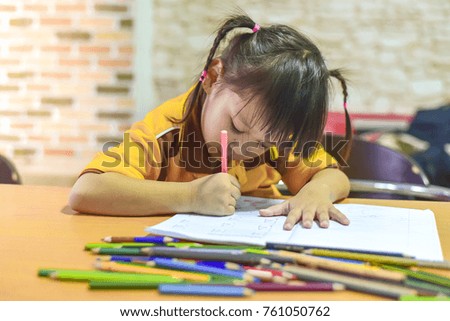 Asian children practice  painting picture in the room