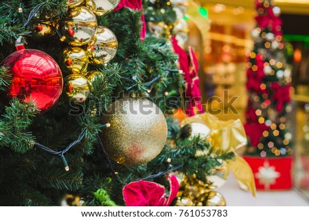 decorated christmas tree in shopping center background