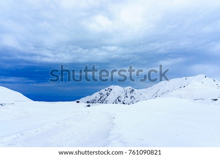 Amazing panorama landscape view of murodo mountain cover with ton of snow on the peak of mountain with blue sky and cloud. winter sport and travel concept.
